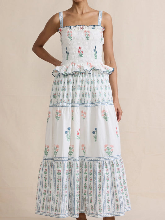 White dress with floral pattern on a beige background